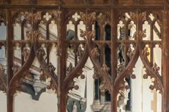 The ornately carved screen tracery 