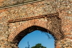 A brick arch over a doorway opening