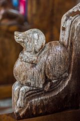 Carved bench end of a dog