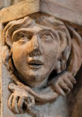 A carved head on the pulpitum screen