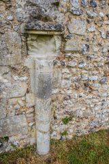 A medieval column set against the Priory wall