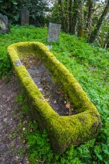 A medieval coffin on the churchyard path