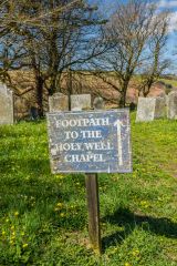 Holy well footpath sign in the churchyard