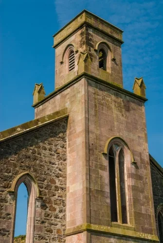 The three-stage neo-Gothic tower