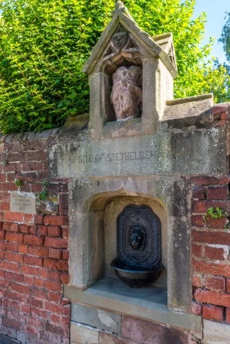 The wellhead and statue