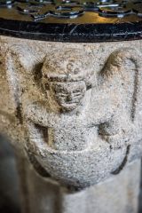 Figure of an angel on the font