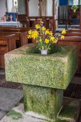 The plainly carved square font