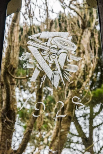 Etched glass design in the Hardy Memorial Window