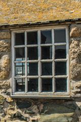 The single mullioned window in the east wall