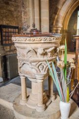 The richly carved 13th century font