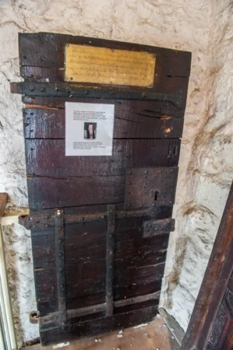 Prison cell door, St Michael-at-the-Northgate Church
