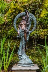 A small statue beside the trail