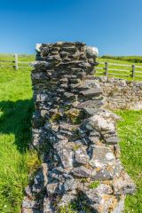 Looking along the stone foundation wall