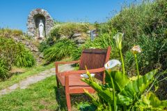 A quiet seating area beside the holy well