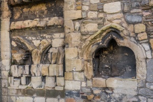 A medieval piscina and carved stones