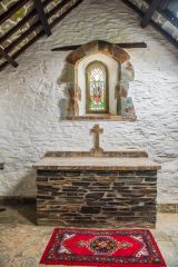 The stone altar and east window