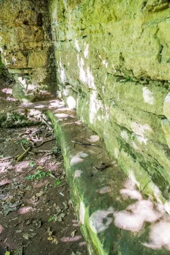 Stone benches along the chapel wall