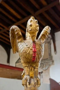 17th century pelican font cover carving