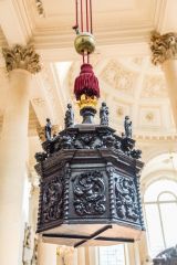 The ornate 17th-century font cover