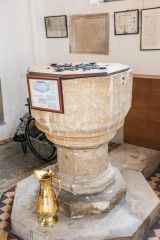 The simply carved Norman font
