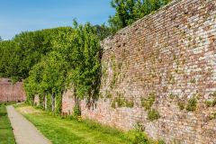 The high brick wall surrounding the walled garden