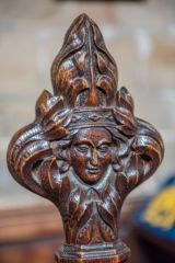 Bench end of a crowned figure