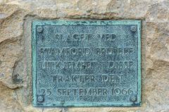 The memorial plaque in Norse