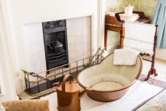 A bath sits before the fire