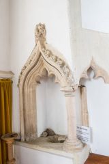 The 14th century angle piscina in the chancel