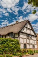 A thatched, timber-framed cottage on Stanway Road