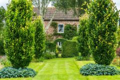 Topiary leads to Stillingfleet Lodge house