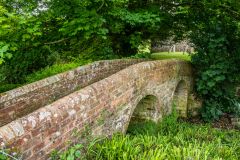 The stone footbridge to the churchyard