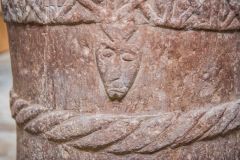 Carved head on the Stogursey Norman font