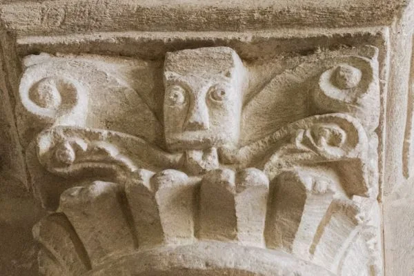 Green Man carving on the 12th-century crossing pillar