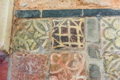 Medieval tiles near the font