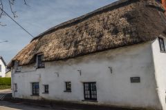 Cob and thatch cottage near the bridge