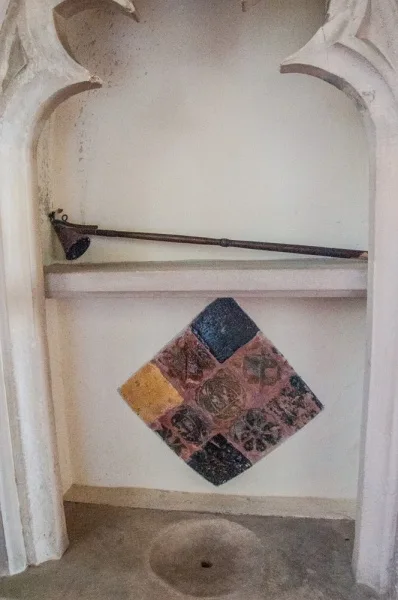 Medieval encaustic tiles in the sanctuary piscina