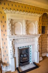 An ornately carved fireplace