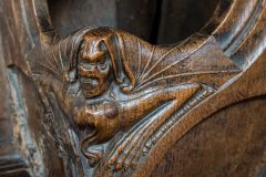 Bench end figure of a dragon