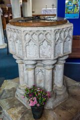 The 14th century font in St Michael's Church