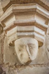 Carved head on a nave pillar