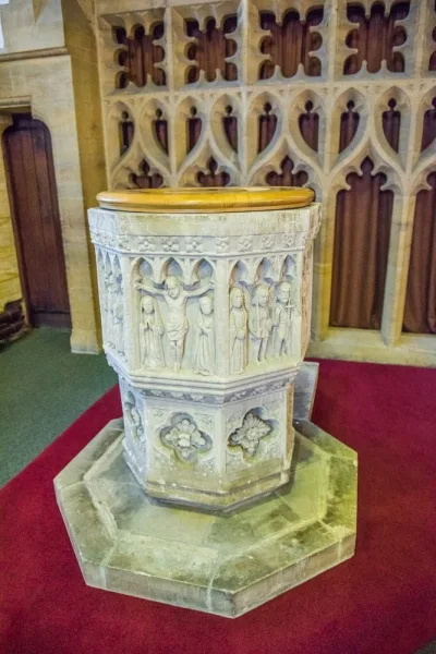 The ornately carved 15th-century font