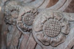 17th century carved arm rests in the chancel
