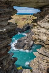 Tintagel Haven through a ruined castle window