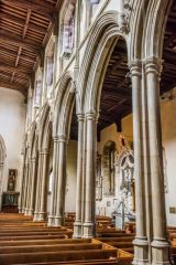 The slender 15th-century nave arcades