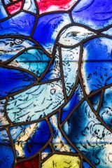 Colourful bird stained glass by Chagall