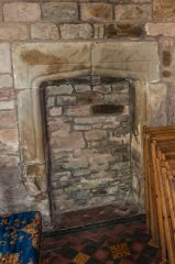 17th century blocked fireplace, chancel wall
