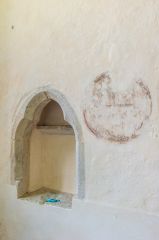 The medieval piscina and consecration cross