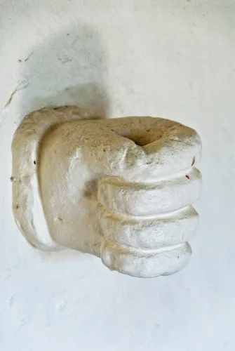 The unusual fist-shaped candelabra