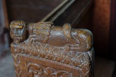15th century lion bench end carving